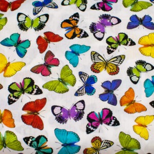 Kolorowe motylki na bieli - tkanina bawełniana
