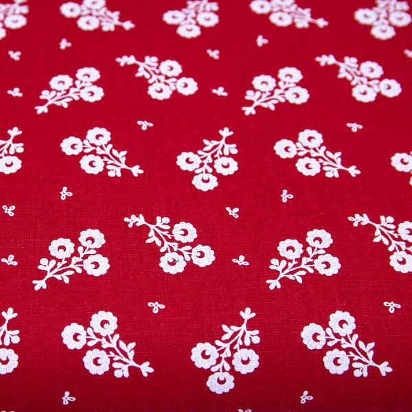 Białe bukieciki na czerwieni - tkanina bawełniana